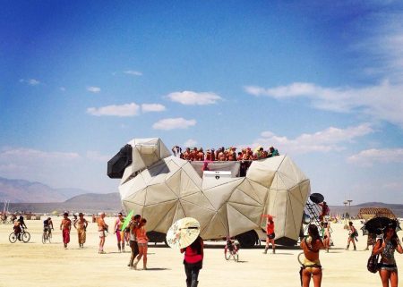 The BAAAHS mutant vehicle, listed for Burning Man 2026, prepared for night-time sound and dance programming.