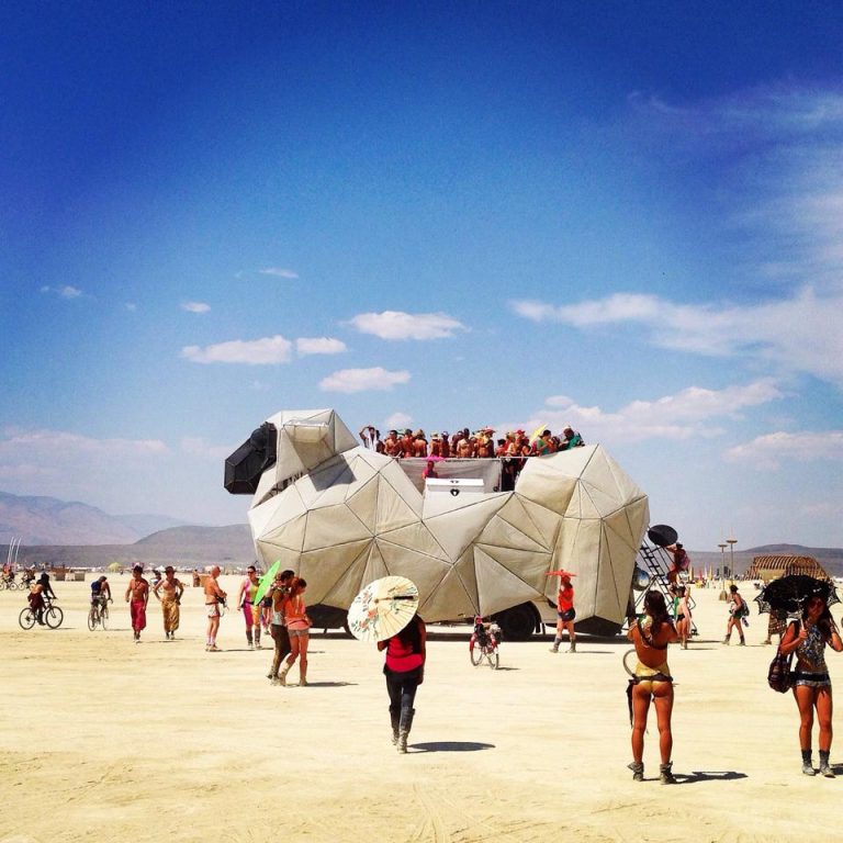 The BAAAHS mutant vehicle, listed for Burning Man 2026, prepared for night-time sound and dance programming.