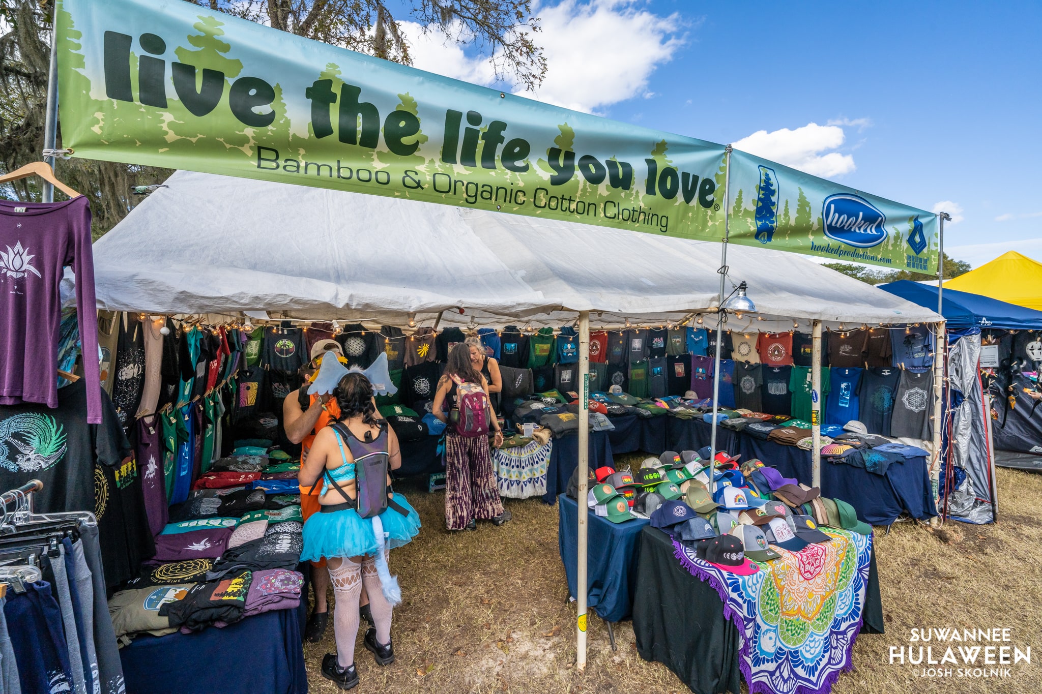 Suwannee Hulaween '26 Market Guide 2 Live The Life You Love clothing vendor tent at Suwannee Hulaween