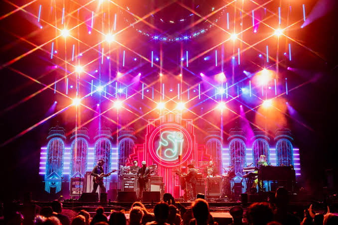 Suwannee Hulaween '26 Sound Guide 3 A band performs on a brightly lit festival stage