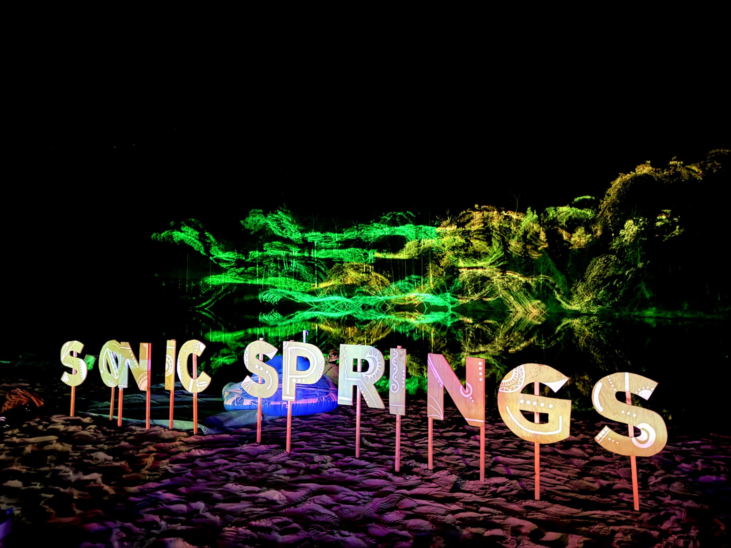 A World Worth Making 12 Colourful lights illuminate the Sonic Springs sign at night